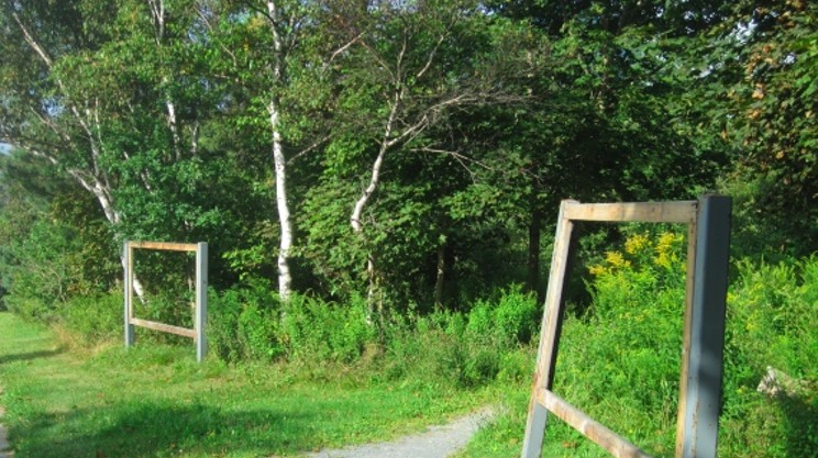 Signs for Urban Wilderness Park go down