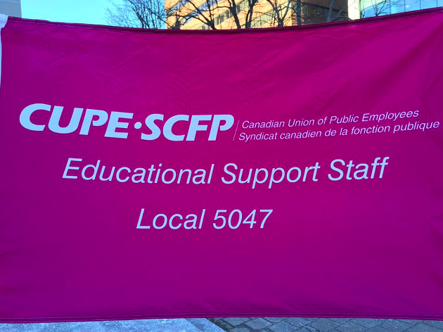 Educational support workers standing with teachers