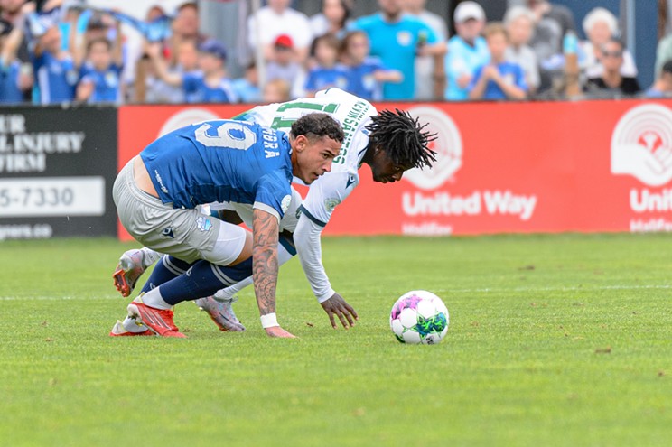 Wanderers forward Tiago Coimbra battles for the ball with York United's Kévin dos Santos on Sept. 4, 2023.