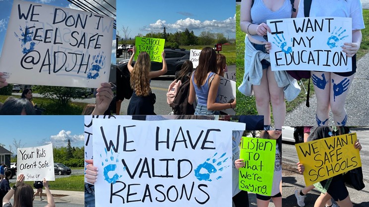 “We don’t feel safe,” read students’ posters at walkout Friday morning